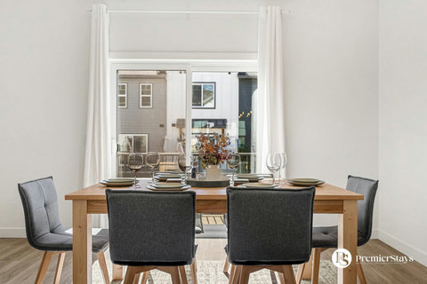 Elegant dining space with natural light and urban views perfect for gatherings