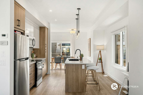 Bright modern kitchen with stylish island and top-tier stainless steel appliances