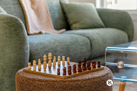 Sophisticated living space with chess board and plush seating