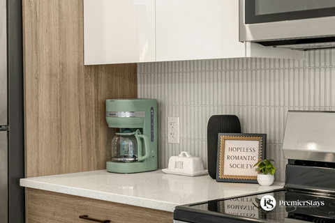 Stylish kitchen counter featuring vintage coffee maker and thoughtful decor