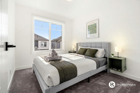 Serene guest bedroom flooded with natural light and contemporary style