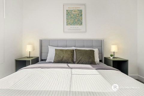 Serene master bedroom with designer furnishings and thoughtful lighting throughout