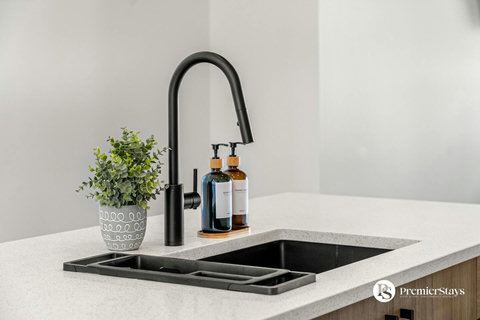 Stylish kitchen sink with contemporary black faucet and curated details