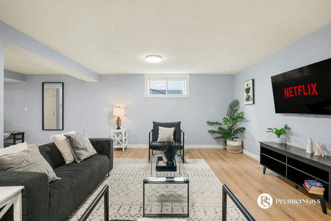 Cozy basement retreat with entertainment setup and comfortable seating