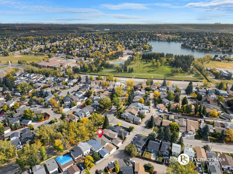 Charming suburban community nestled among trees with scenic lake views