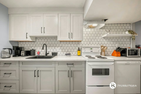 Bright, fully equipped kitchen with modern finishes and stainless steel appliances
