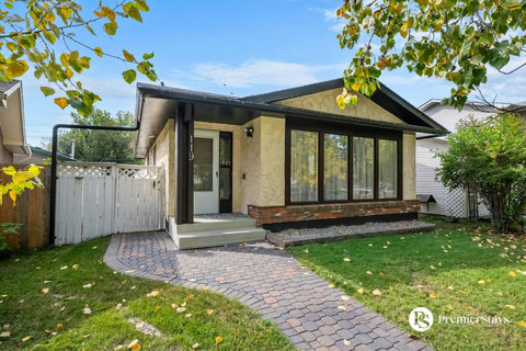 Welcome to your own private oasis with beautiful front patio and lawn space
