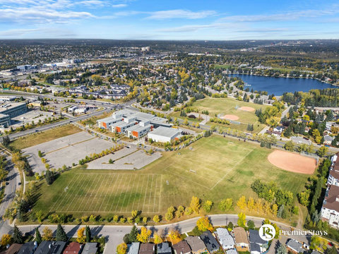 Beautiful aerial perspective of the vibrant neighborhood with sparkling lake views