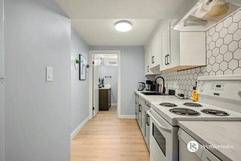 Bright, well-equipped galley kitchen with modern finishes and stainless appliances