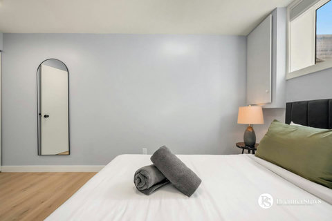 Serene guest bedroom featuring modern furnishings and clean design