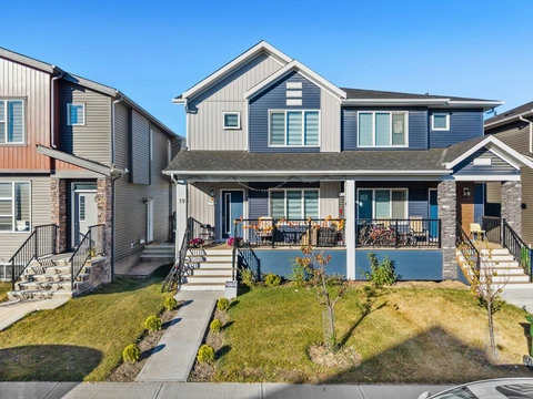 Welcome to your modern townhome with stylish front porch and mature landscaping