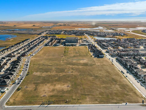 Stunning aerial perspective of vibrant new community development and natural surroundings