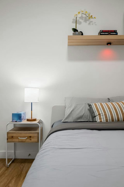 Serene guest bedroom with modern minimalist design and natural light