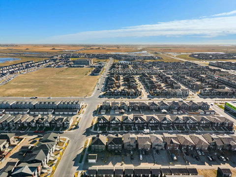 Stunning bird's eye view of the vibrant suburban community surrounding your home
