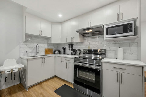 Fully equipped modern kitchen with sleek stainless steel appliances