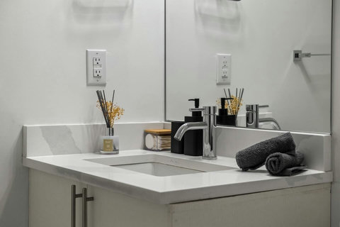 Sleek dual vanity bathroom with contemporary chrome fixtures and ample counter space