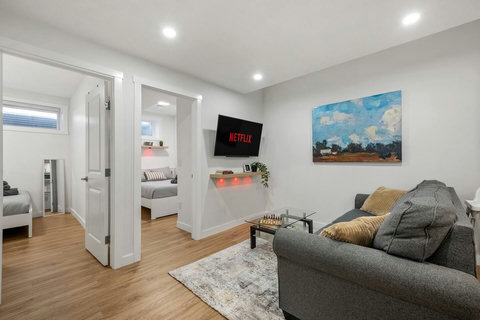 Relax in this bright modern living room with streaming entertainment