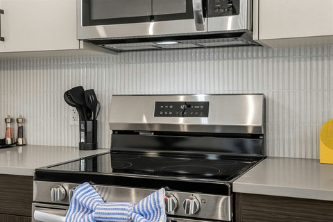 Chef's kitchen featuring modern stainless steel appliances and clean design.