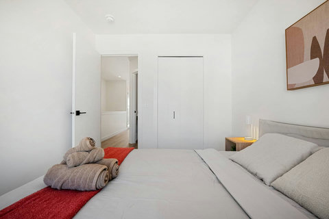 Welcoming guest bedroom with fresh linens and thoughtful hospitality touches