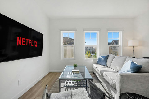 Comfortable living room with smart TV and stunning city views