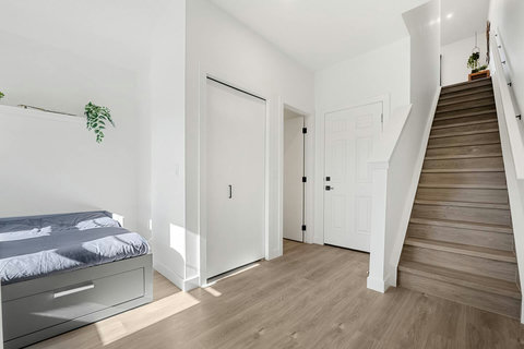 Light-filled bedroom offering convenient access to upper floors