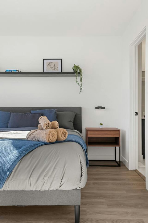 Comfortable guest bedroom with contemporary furnishings and thoughtful styling