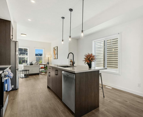 Sleek modern kitchen with spacious island and stainless steel appliances