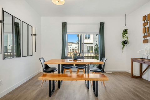 Bright dining space perfect for gatherings with stunning balcony views