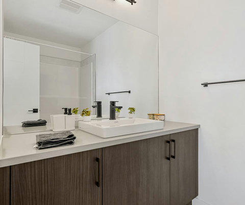 Spa-inspired master bathroom with elegant double vanity and natural light