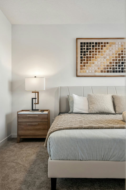 Serene guest bedroom with soft neutral tones and modern furnishings