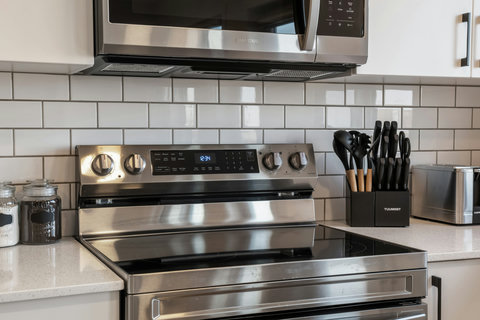 Chef's kitchen featuring stainless steel appliances and contemporary design