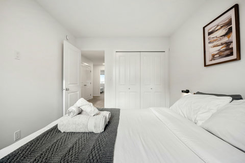 Comfortable guest bedroom with dual beds and ample closet space