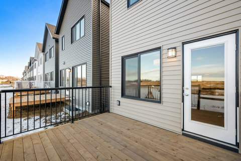 Step onto your private deck overlooking open countryside and neighboring homes