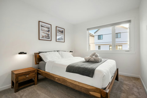 Serene guest bedroom with natural light and modern comfort