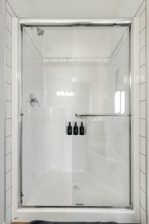 Luxurious walk-in shower featuring premium toiletries and rainfall showerhead
