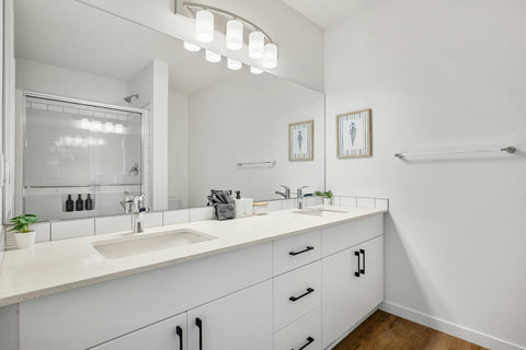 Spa-like master bathroom featuring dual vanity and spacious walk-in shower