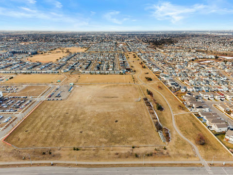 Expansive aerial perspective of the surrounding suburban community and landscape