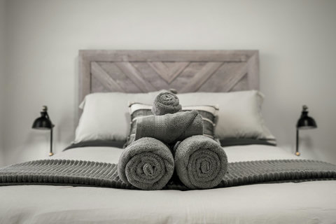 Luxurious bedroom with plush bedding and thoughtful spa-style touches