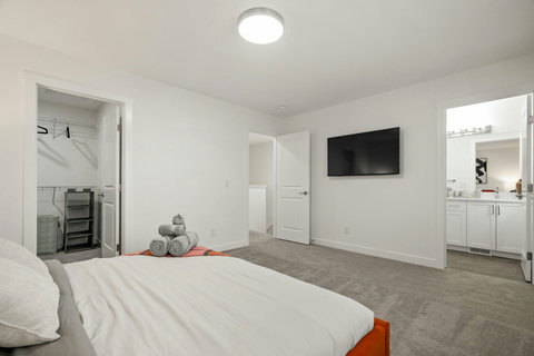 Comfortable guest bedroom with entertainment and private bathroom access