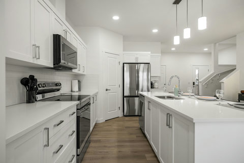 Bright modern kitchen perfectly equipped for culinary adventures and gatherings