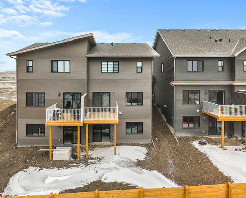 Contemporary townhome community with spacious wooden decks and modern finishes