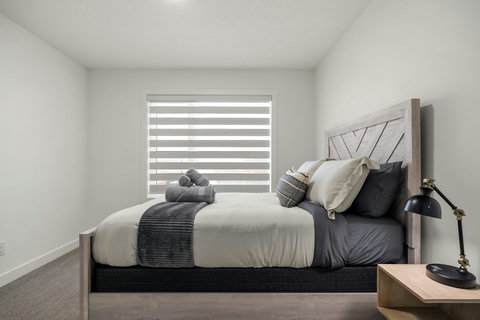 Bright, stylish guest bedroom with contemporary design and natural light