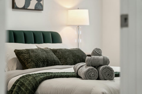 Stylish bedroom retreat with designer touches and plush bedding details