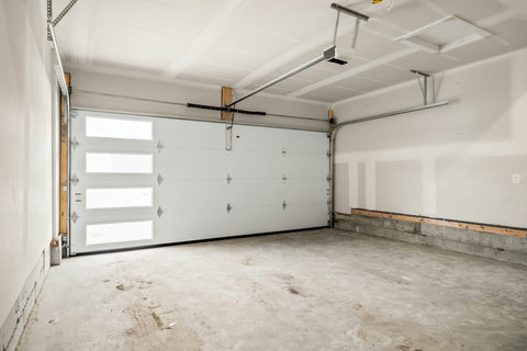 Spacious two-car garage perfect for vehicles or storage needs.