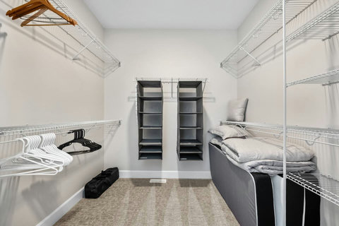 Stay organized with a generous walk-in closet and hanging storage organizers