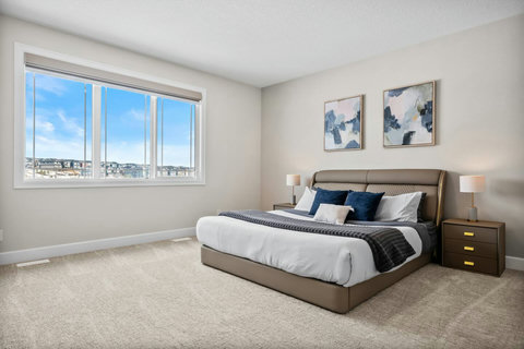 Wake up refreshed in this serene king bedroom with sweeping views