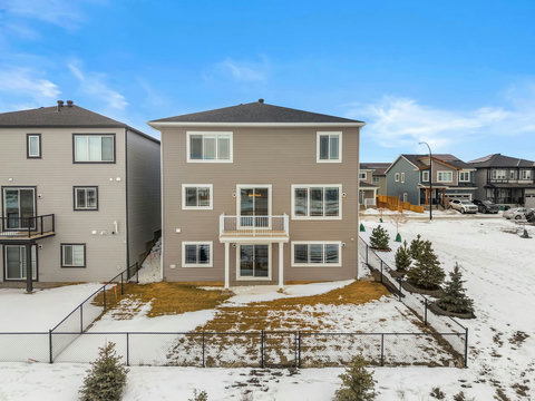 Modern three-storey home with private fenced yard and elevated deck