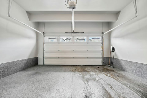 Spacious garage with EV charger ready for your electric vehicle