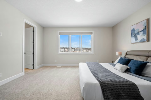 Rest easy in this expansive master bedroom with sweeping neighbourhood views