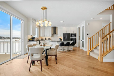 Gather for memorable meals under a stunning gold pendant chandelier